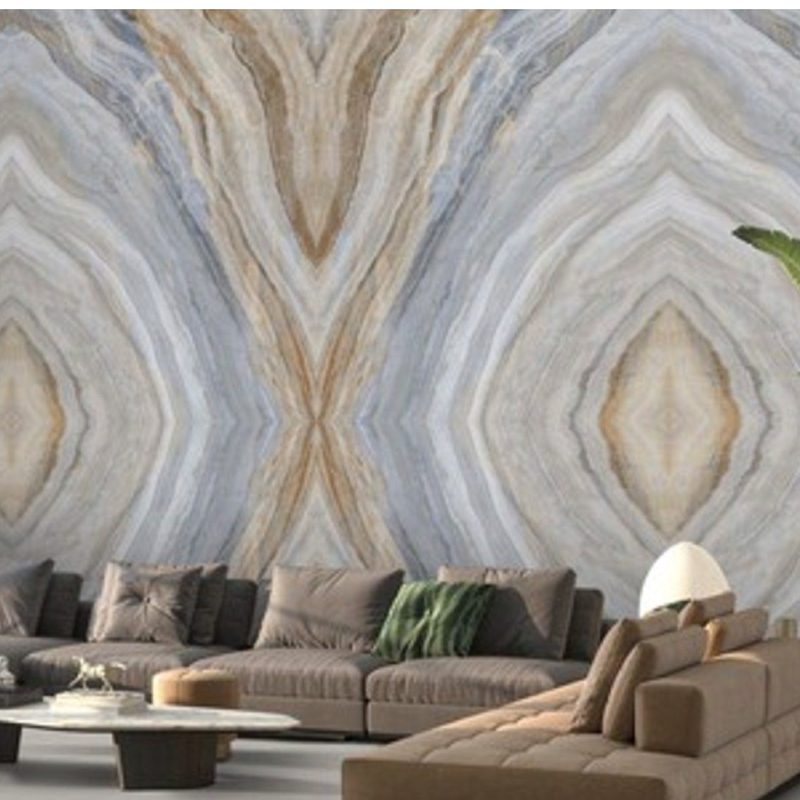 Book matched blue onyx look porcelain feature wall behind a lounge
