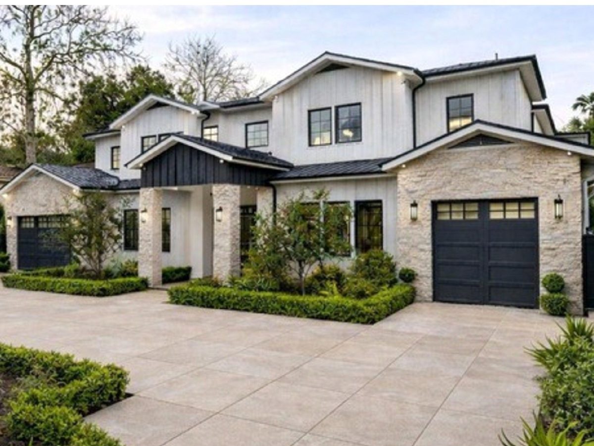 Sand-toned large format porcelain paver driveway at a modern home